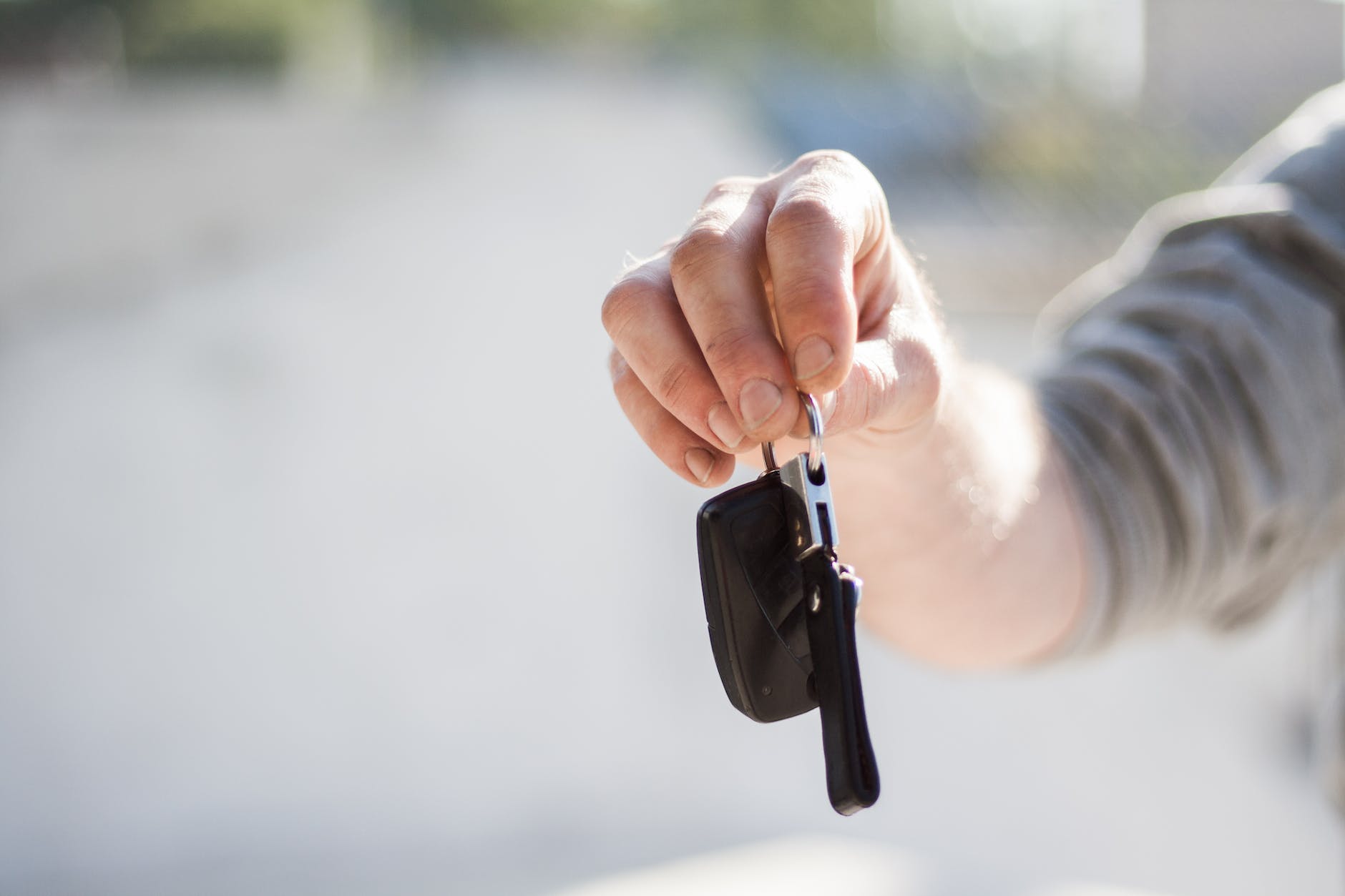 a person renting out their car handing over the keys