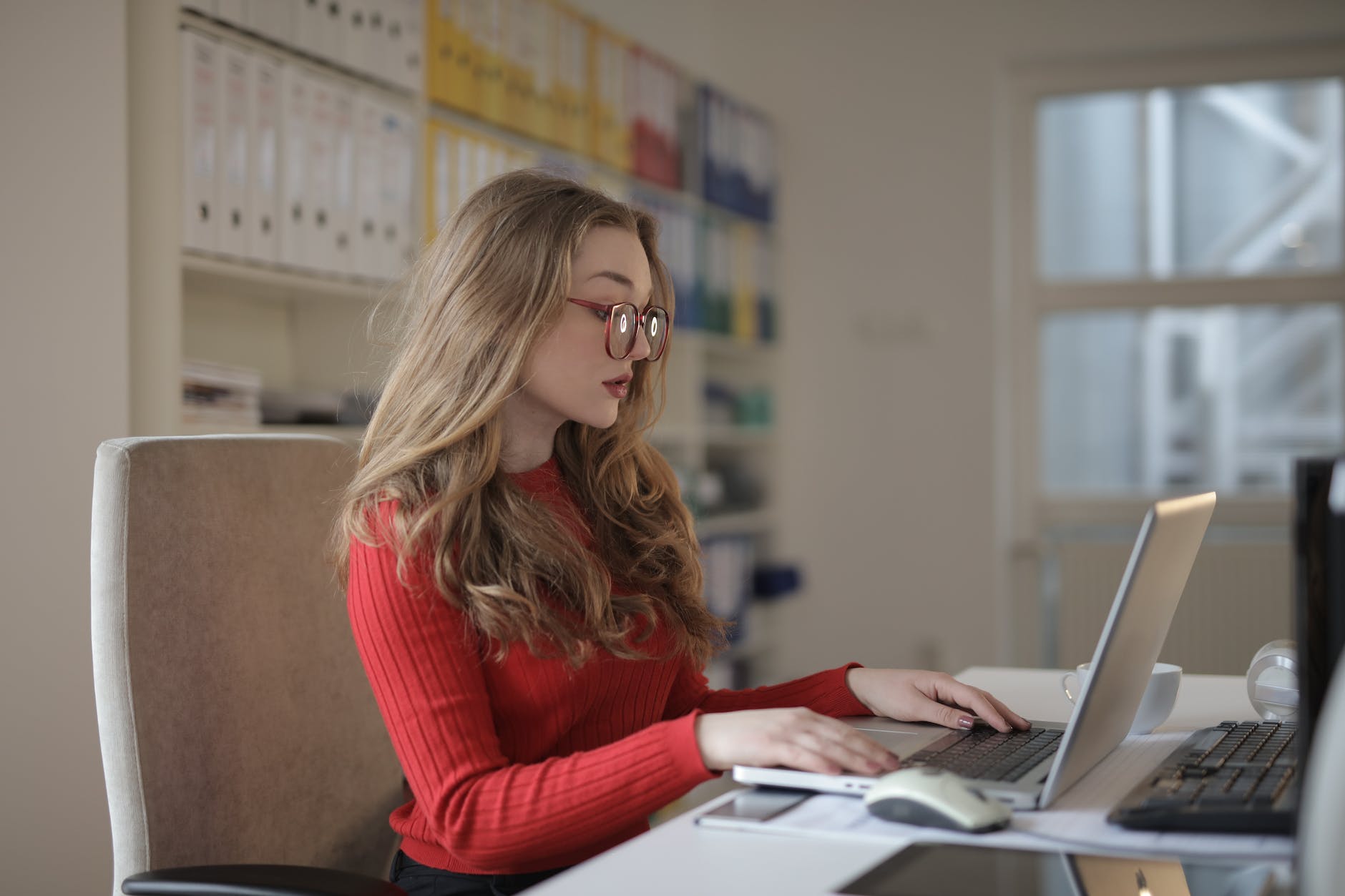 a lady working at her desk as a bookkeeper